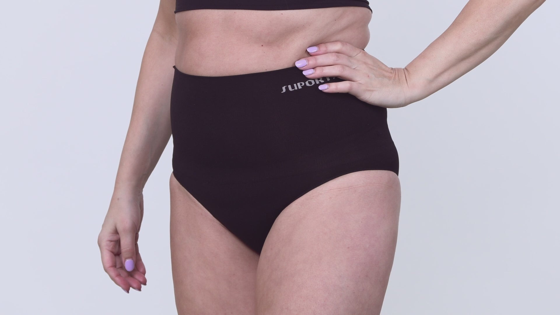 Video of a model wearing Suportx Breathable Briefs in black color. Show casing the ostomy underwear from left to right angle.